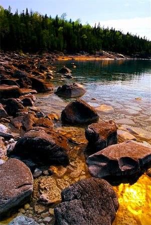 simsearch:400-05150811,k - Rocks in clear golden water of Georgian Bay at Bruce peninsula Ontario Canada Stock Photo - Budget Royalty-Free & Subscription, Code: 400-05111354