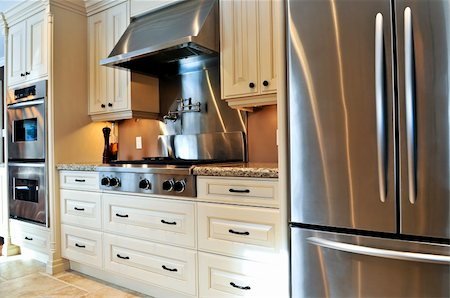 Interior of modern luxury kitchen with stainless steel appliances Foto de stock - Super Valor sin royalties y Suscripción, Código: 400-05111367