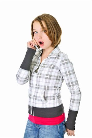 simsearch:400-04130279,k - Teenage girl talking on a cell phone acting surprised isolated on white background Stockbilder - Microstock & Abonnement, Bildnummer: 400-05111397