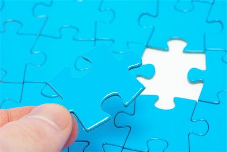 hands holding a puzzle piece . business concepts Stock Photo - Budget Royalty-Free & Subscription, Code: 400-05111684