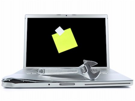 simsearch:400-04971966,k - Damaged laptop with a spanner over it and a blank post-it on the screen. Isolated on white. Stock Photo - Budget Royalty-Free & Subscription, Code: 400-05111715