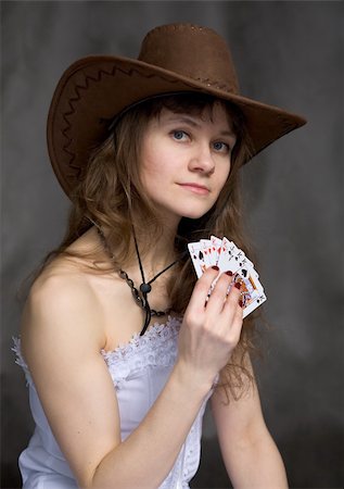 Portrait girl with a playing-cards in hand on black Stock Photo - Budget Royalty-Free & Subscription, Code: 400-05111795