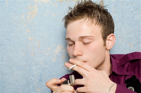 simsearch:400-04631926,k - portrait of the young man with a cigarette Stock Photo - Budget Royalty-Free & Subscription, Code: 400-05111850