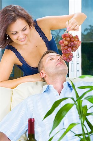 photo of model woman with grapes - Close up portrait of nice young brunette tempting  her boyfriend Stock Photo - Budget Royalty-Free & Subscription, Code: 400-05112482