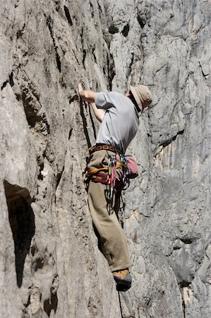 simsearch:400-04037283,k - Man climbing a rock wall in paklenica national park Stock Photo - Budget Royalty-Free & Subscription, Code: 400-05112657
