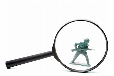 simsearch:400-04909573,k - A toy soldier being investigated under a magnifying glass. Foto de stock - Super Valor sin royalties y Suscripción, Código: 400-05113425