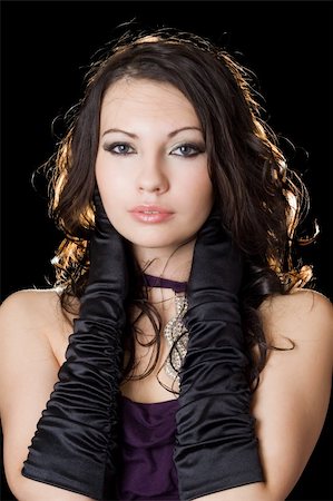 simsearch:400-06694116,k - Beautiful young woman in a violet dress over black Photographie de stock - Aubaine LD & Abonnement, Code: 400-05113469