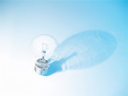 simsearch:640-01354128,k - The picture of an electric lightbulb on blue background Photographie de stock - Aubaine LD & Abonnement, Code: 400-05113550