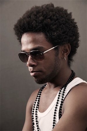 simsearch:400-04539832,k - Portrait of young trendy african man with sunglasses Foto de stock - Royalty-Free Super Valor e Assinatura, Número: 400-05113734