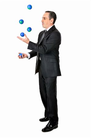 Business man in suit juggling planet earth balls Stock Photo - Budget Royalty-Free & Subscription, Code: 400-05113918