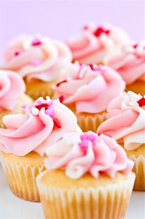 paper cups decorated - Lots of tasty cupcakes with icing and sprinkles Stock Photo - Budget Royalty-Free & Subscription, Code: 400-05113937