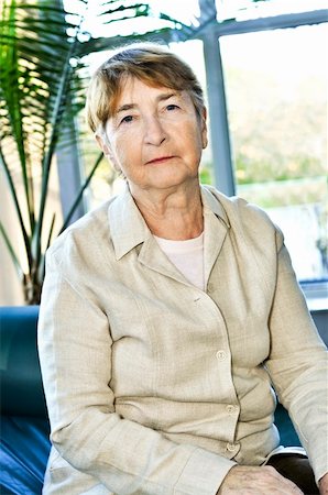 sad grandmother - Sad elderly woman sitting on a couch indoors Stock Photo - Budget Royalty-Free & Subscription, Code: 400-05113975