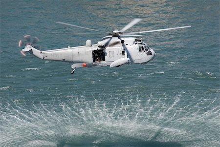stockarch (artist) - An Australian navy sea king helicopter practising a rescue Stock Photo - Budget Royalty-Free & Subscription, Code: 400-05124010