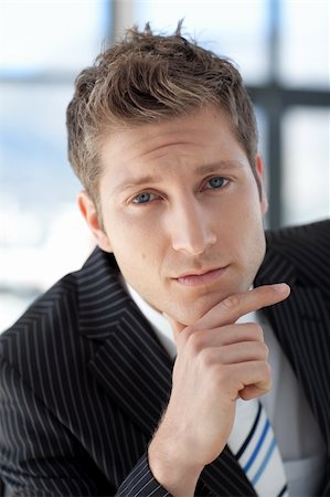 simsearch:400-04643781,k - Attractive Businessman looking at camera Stock Photo - Budget Royalty-Free & Subscription, Code: 400-05124156