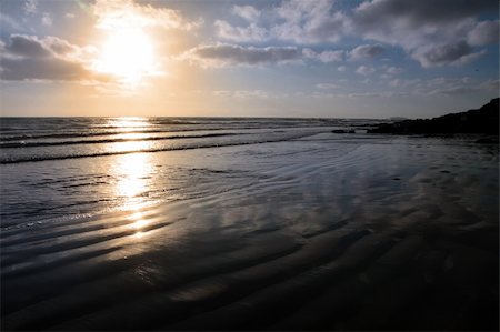 dream destination - the waves with reflection crashing in on youghal beach ireland Stock Photo - Budget Royalty-Free & Subscription, Code: 400-05124403