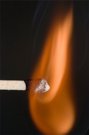 Close-up of a match as it first catches fire. Stock Photo - Budget Royalty-Free & Subscription, Code: 400-05124464