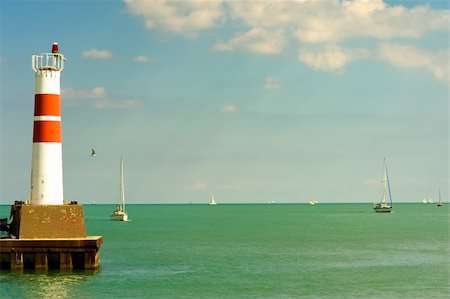 dock green red light - Lighthouse with Sailboats Stock Photo - Budget Royalty-Free & Subscription, Code: 400-05124642