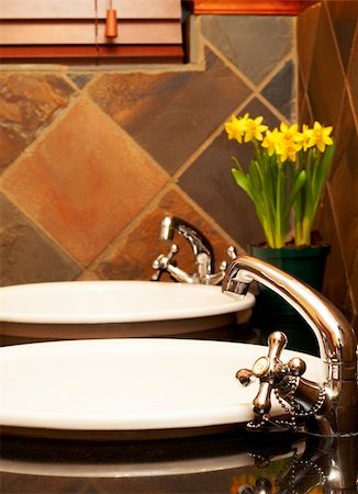 Beautiful bathroom with white sinks, granite tops and rustic tiles Stock Photo - Budget Royalty-Free & Subscription, Code: 400-05125422