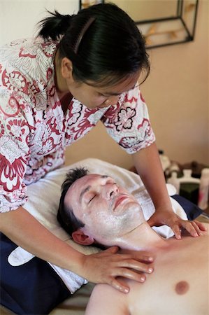 Asian girl does massage of the face to the man Stock Photo - Budget Royalty-Free & Subscription, Code: 400-05125865