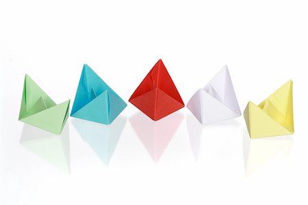 Five colorful paper boats isolated on white with clipping path Fotografie stock - Microstock e Abbonamento, Codice: 400-05125876