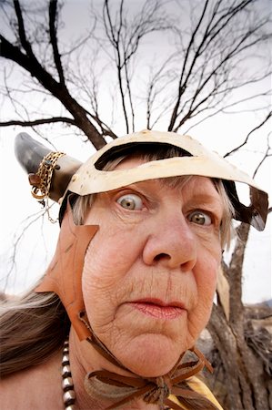 eccentric elderly people photos - Crazy old woman wearing a Viking helmet Stock Photo - Budget Royalty-Free & Subscription, Code: 400-05126289