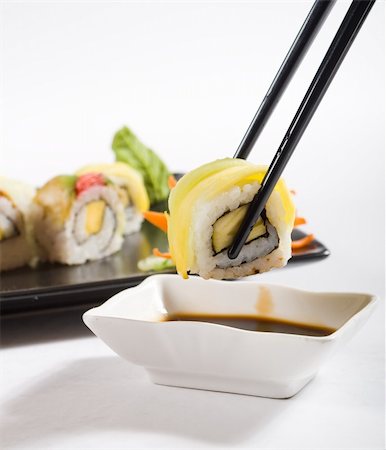 japanese sushi roll dipping in soy sauce Stock Photo - Budget Royalty-Free & Subscription, Code: 400-05126325