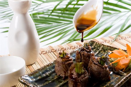 pouring soy sauce on beef roll Stock Photo - Budget Royalty-Free & Subscription, Code: 400-05126353