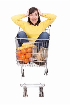 happy brunette woman with shopping cart. over white background Stock Photo - Budget Royalty-Free & Subscription, Code: 400-05126793