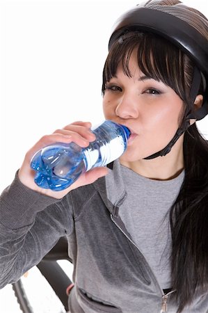 riding a bike funny pic - attractive brunette woman with bike. over white background Stock Photo - Budget Royalty-Free & Subscription, Code: 400-05126806