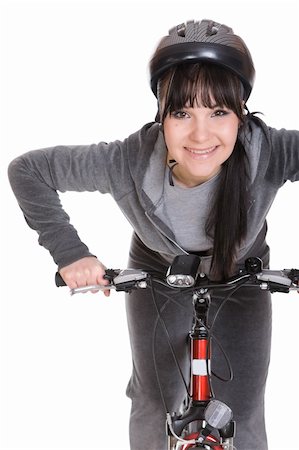 riding a bike funny pic - attractive brunette woman with bike. over white background Stock Photo - Budget Royalty-Free & Subscription, Code: 400-05126807