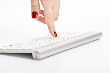 Fingers with red nail touching keyboard Stock Photo - Budget Royalty-Free & Subscription, Code: 400-05126968