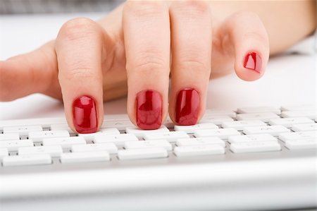 Fingers with red nail typing on keyboard Stock Photo - Budget Royalty-Free & Subscription, Code: 400-05126969