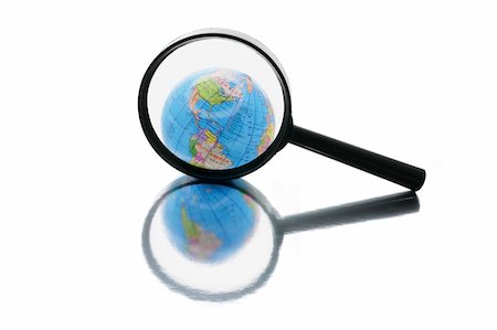 simsearch:400-04774467,k - Globe under Magnifying Glass on Isolated White Background Stock Photo - Budget Royalty-Free & Subscription, Code: 400-05127186