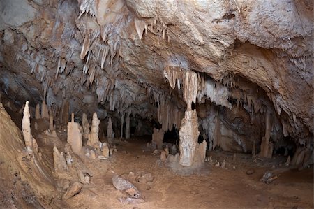 stalagmite - Coatia is full of caves like this one in limestone rocks. This is Inside details with  stalagmites and stalactites . Location: Dubrovnik area. Fish lenses shot. 30sek shot with aprox. 30 flashes fired. Stock Photo - Budget Royalty-Free & Subscription, Code: 400-05127433