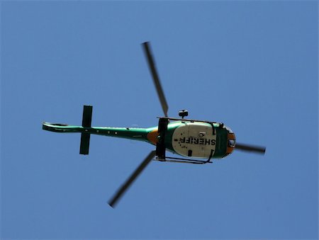 Sherrif helicopter  flying overhead on patrol Foto de stock - Super Valor sin royalties y Suscripción, Código: 400-05128164