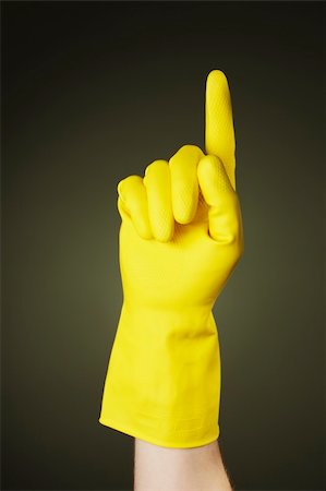 rubber hand gloves - A Hand with a yellow protective rubber glove pointing with a finger Stock Photo - Budget Royalty-Free & Subscription, Code: 400-05128408