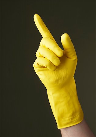 rubber hand gloves - A Hand with yellow protective glove pointing with a finger Stock Photo - Budget Royalty-Free & Subscription, Code: 400-05128410