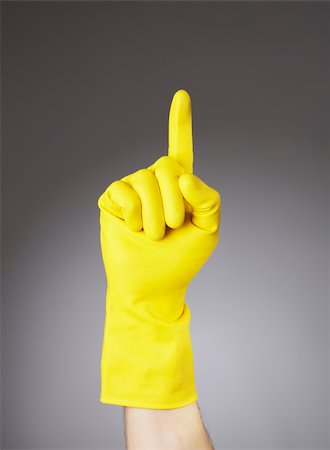 rubber hand gloves - A Hand with yellow protective glove pointing with index finger Stock Photo - Budget Royalty-Free & Subscription, Code: 400-05128422