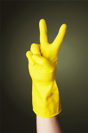 rubber hand gloves - A Hand with yellow protective rubber glove doing a "V" sign Stock Photo - Budget Royalty-Free & Subscription, Code: 400-05128436