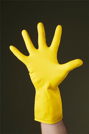 rubber hand gloves - Hand with a protective yellow rubber glove Stock Photo - Budget Royalty-Free & Subscription, Code: 400-05128437