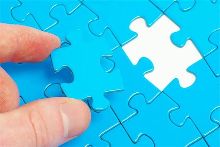 hands holding a puzzle piece . business concepts Stock Photo - Budget Royalty-Free & Subscription, Code: 400-05128574