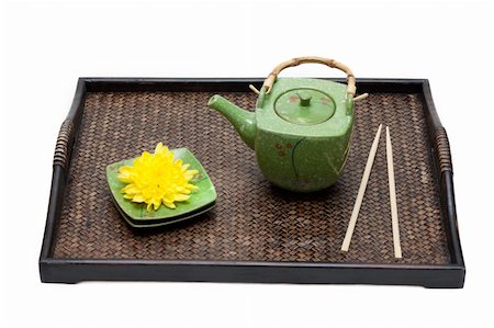 Bamboo tray, green ceramic teapot, saucer, yellow chrysanthemum and chopstick on white background Stock Photo - Budget Royalty-Free & Subscription, Code: 400-05128664