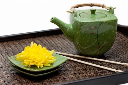 simsearch:400-05153477,k - Bamboo tray, green ceramic teapot, saucer, yellow chrysanthemum and chopstick on white background Photographie de stock - Aubaine LD & Abonnement, Code: 400-05128665
