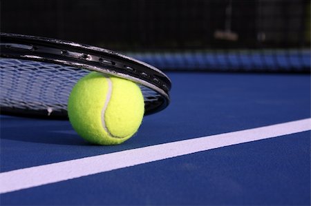 Tennis ball and racket on a blue modern court Stock Photo - Budget Royalty-Free & Subscription, Code: 400-05128795