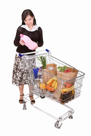 attractive brunette woman with shopping cart. over white background Stock Photo - Budget Royalty-Free & Subscription, Code: 400-05129027