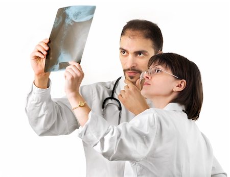 simsearch:400-04508758,k - Two doctors watching an xray over a white background Foto de stock - Super Valor sin royalties y Suscripción, Código: 400-05129205