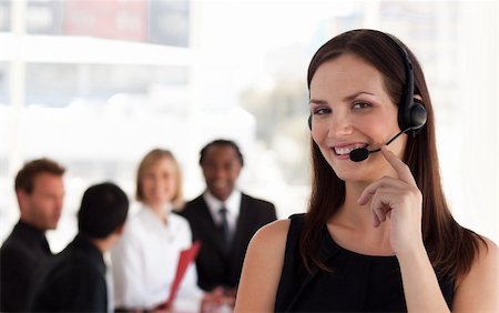 simsearch:400-04233879,k - Young attractive woman talking on a headset in Office Photographie de stock - Aubaine LD & Abonnement, Code: 400-05129746