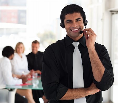 simsearch:400-04129170,k - Young Businessman talking on a headset Fotografie stock - Microstock e Abbonamento, Codice: 400-05129754