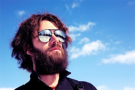 pilot pose - A male with a full beard and retro sunglasses standing in a winter landscape - cross processed Stock Photo - Budget Royalty-Free & Subscription, Code: 400-05129877