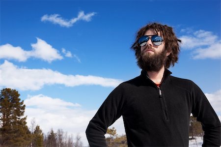 pilot pose - A male standing in a winter landscape ready for adventure Stock Photo - Budget Royalty-Free & Subscription, Code: 400-05129879